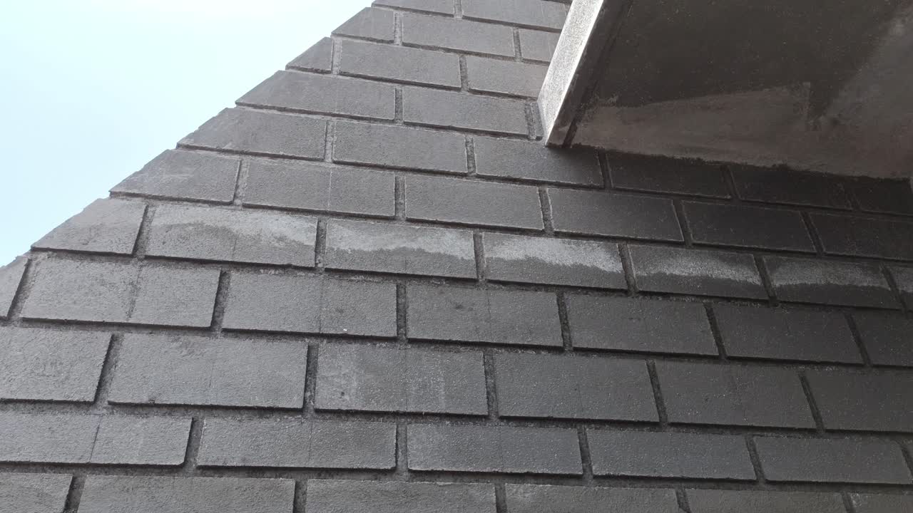 Architectural designer designing a box on the plaster wall. Amazing Construction Ideas Construction From Cement On The Wall During daytime - Rendering Technique Using Sand And Cement On Concrete Walls