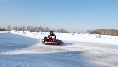child go-karting on ice