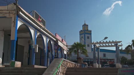 market and mosque in tagahzout village morocco