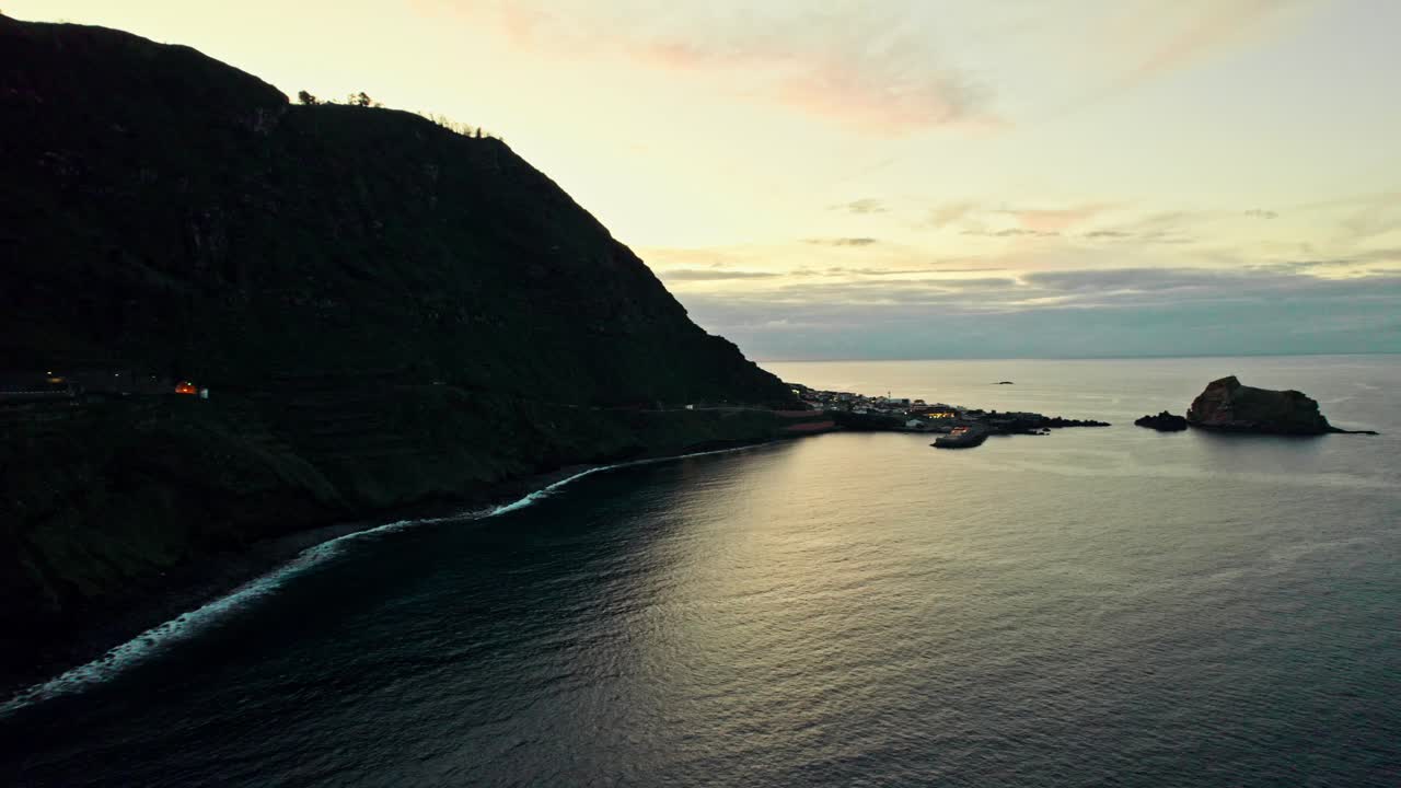Coastal Sunset View of a Village on an Island