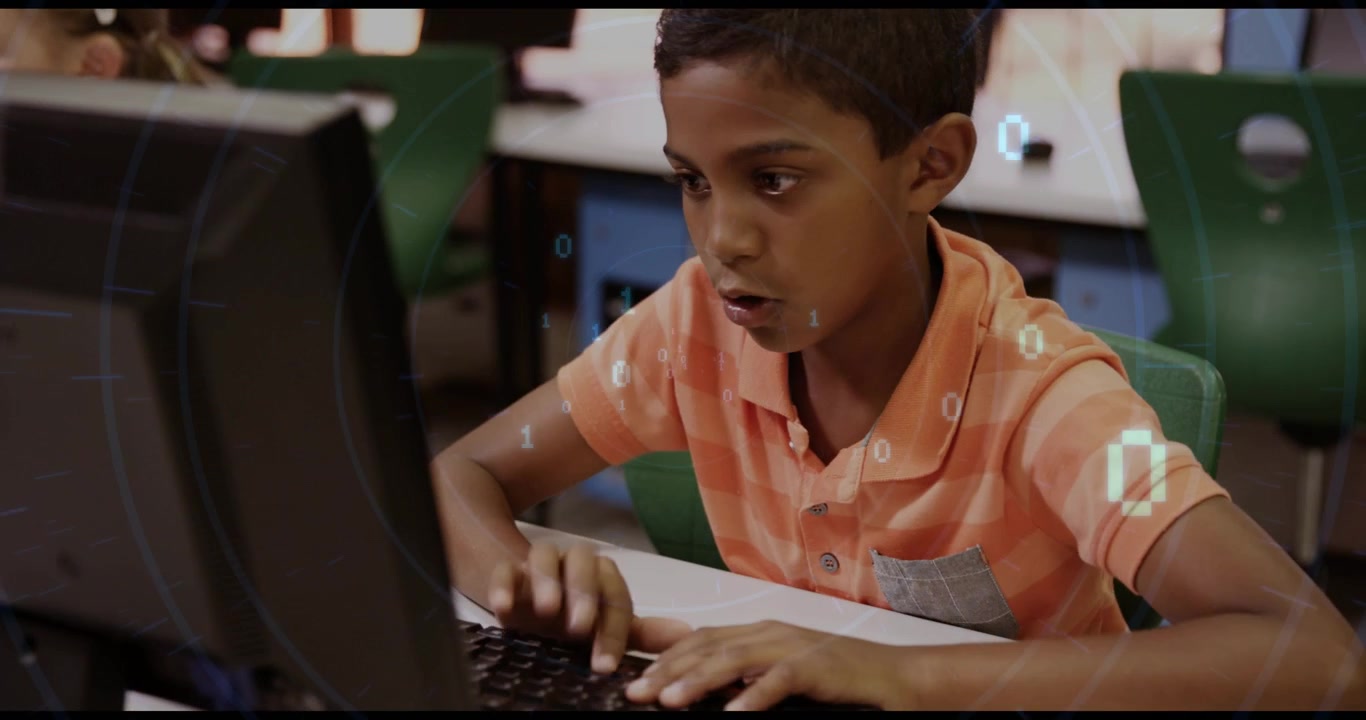 Boy placing fingers on keyboard initiating binary overlay and coding lesson in school lab