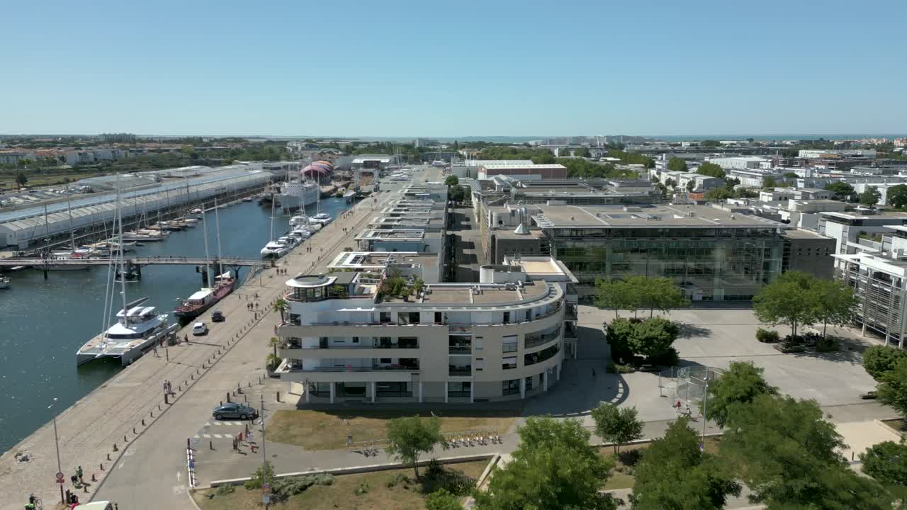 Luxury building and Michel-Cr&eacute;peau Media Library along canal of La Rochelle old port, France