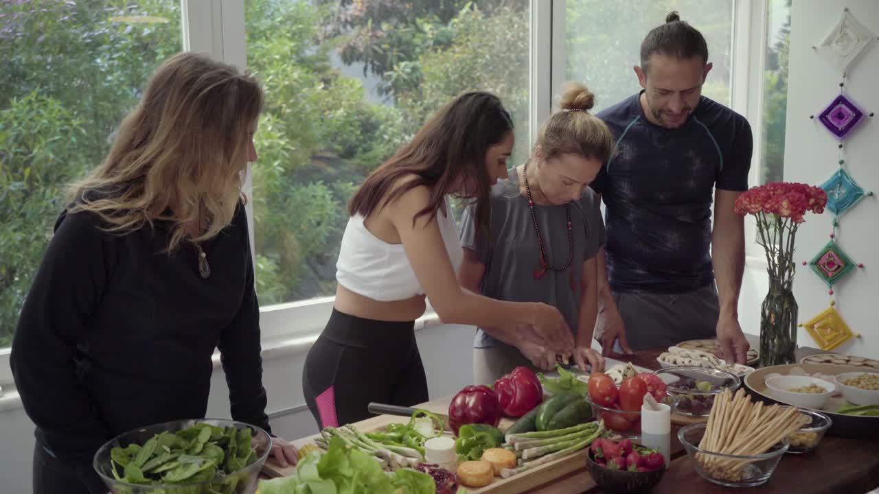 Young people cooking together in kitchen