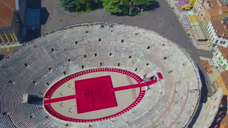 aerial view of arena di verona, italy. the drone moves away from the arena. a view of the arena and the city opens.