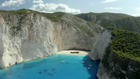 drone aerial zoom out smooth shot of navagio beach in zakynthos, greece