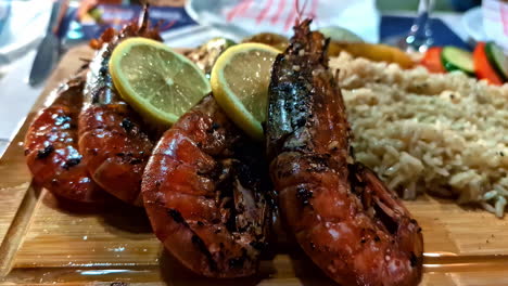 wooden tray with delicious fried shrimps with rice. close up