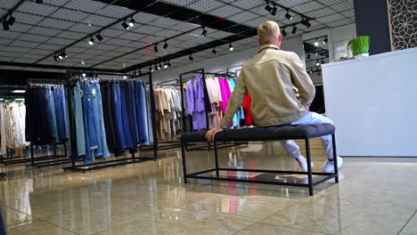 man shopping in a clothing store