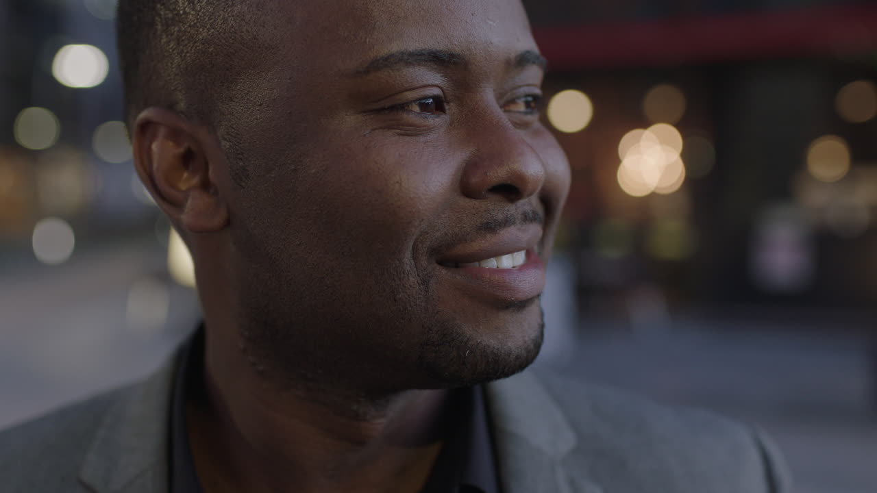 close up portrait of african american businessman looking to side thinking pensive successful male entrepreneur enjoying success