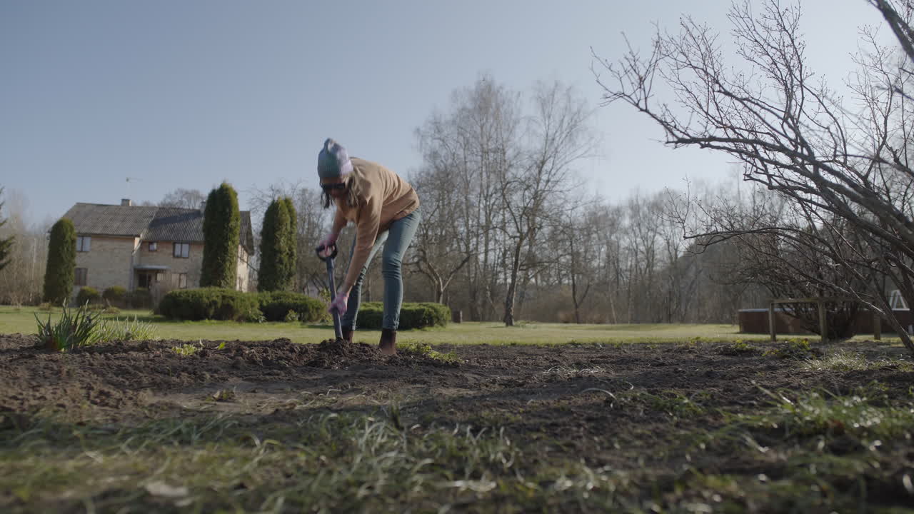 Young Female working in Garden. Crab Right.