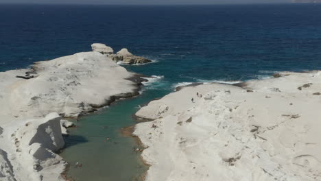 Wide-Aerial-Establishing-Shot-of-Sarakiniko-Lunar-Volcanic-Beach-in-Milos-Island,-Greece