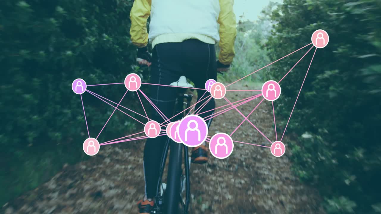 Cyclist pedaling forest trail causing user icon network morphing around rear wheel for tech demo