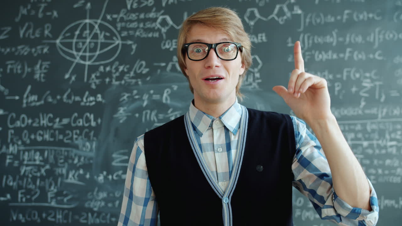 Teacher in front of a chalkboard