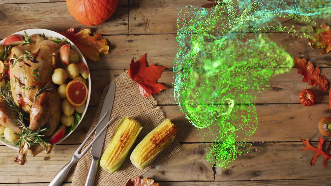 Thanksgiving feast with corn and turkey, green particles animation over table