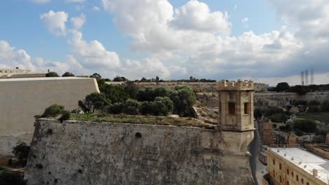 Malta-Valletta-city-old-fortress-tower-drone-flight-Sa-maison-gardens-fortifications