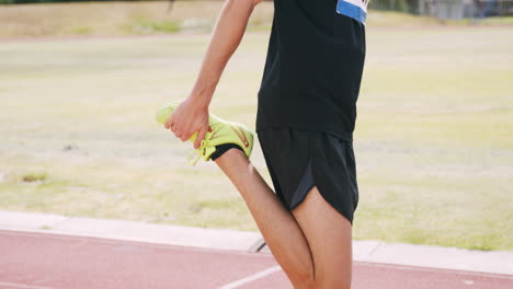 focused sportsman stretching