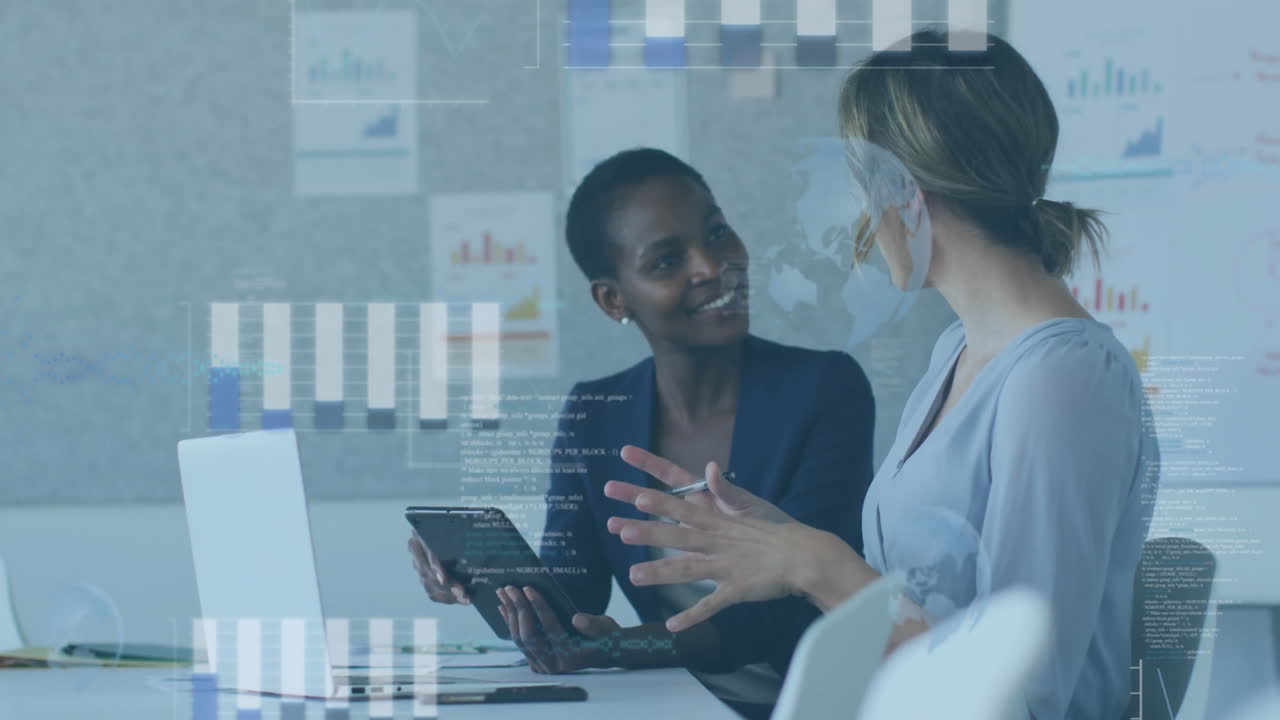 Discussing data analytics with animation, businesswomen in modern office setting