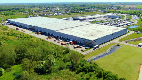 Aerial-view-of-warehouse-storages-or-industrial-factory-or-logistics-center-from-above