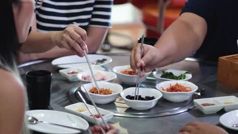 group enjoying traditional korean dishes together