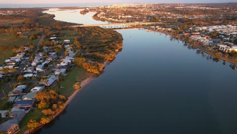 sunset scenery over maroochy river with talep bridge in the sunshine coast region, queensland, australia - aerial shot