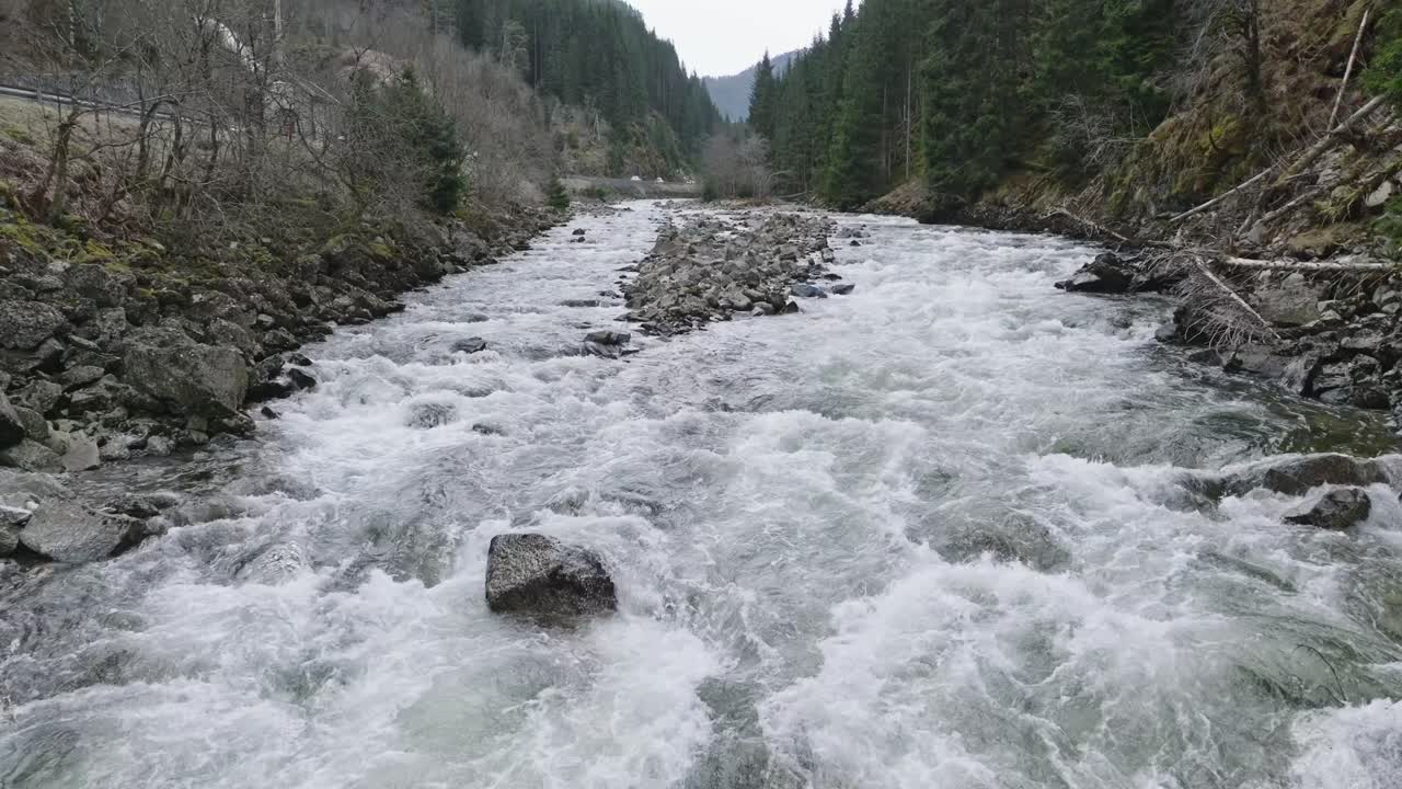 Long Drone Shot of Latefossen Waterfall From Gronsdalslona River and Road Bridge to Hilltop Buildings, Norway