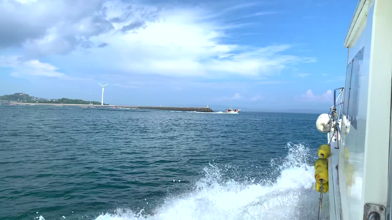 Motor boat to transport tourists sailing in the sea near the coast in the tourist for watching Dolphins and paradise in Amakusa Japan
