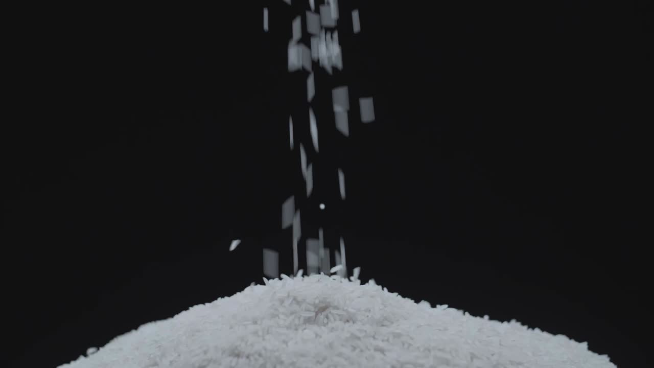 Slow Motion Of Close Up Falling Raw Rice. Uncook Rice