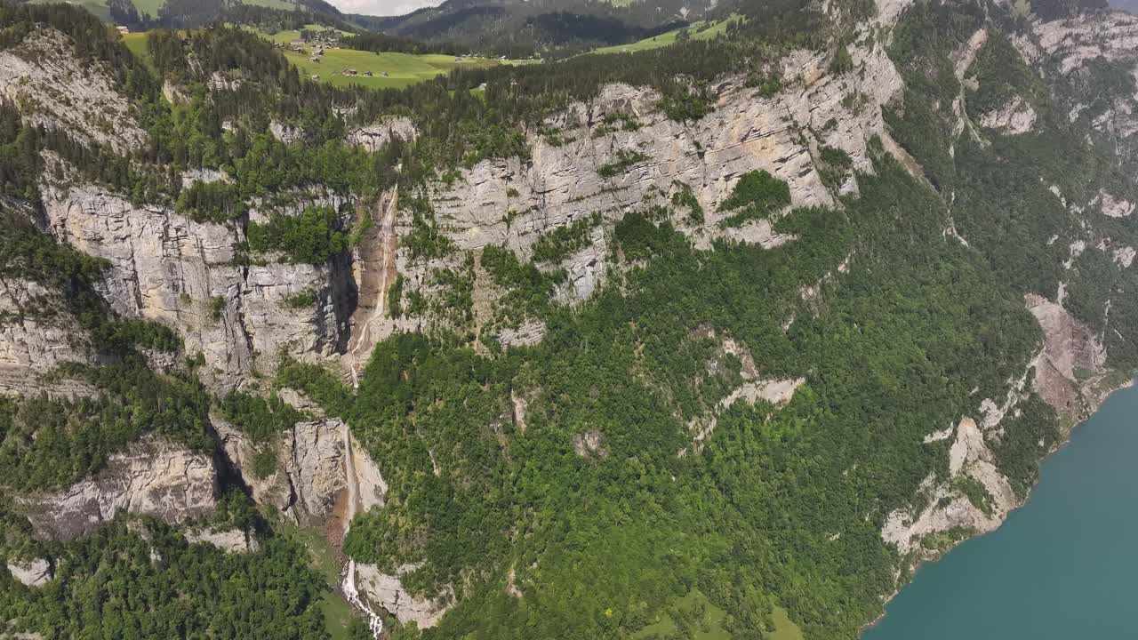 Breathtaking aerial view of Seerenbachfälle waterfalls and Walensee in Switzerland