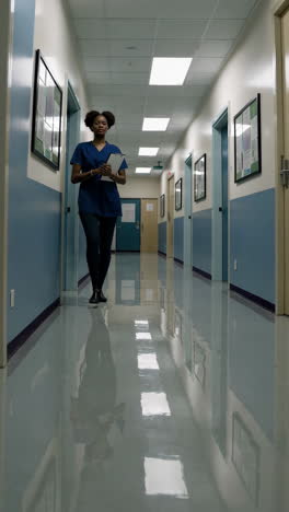 hospital corridor with staff and patients