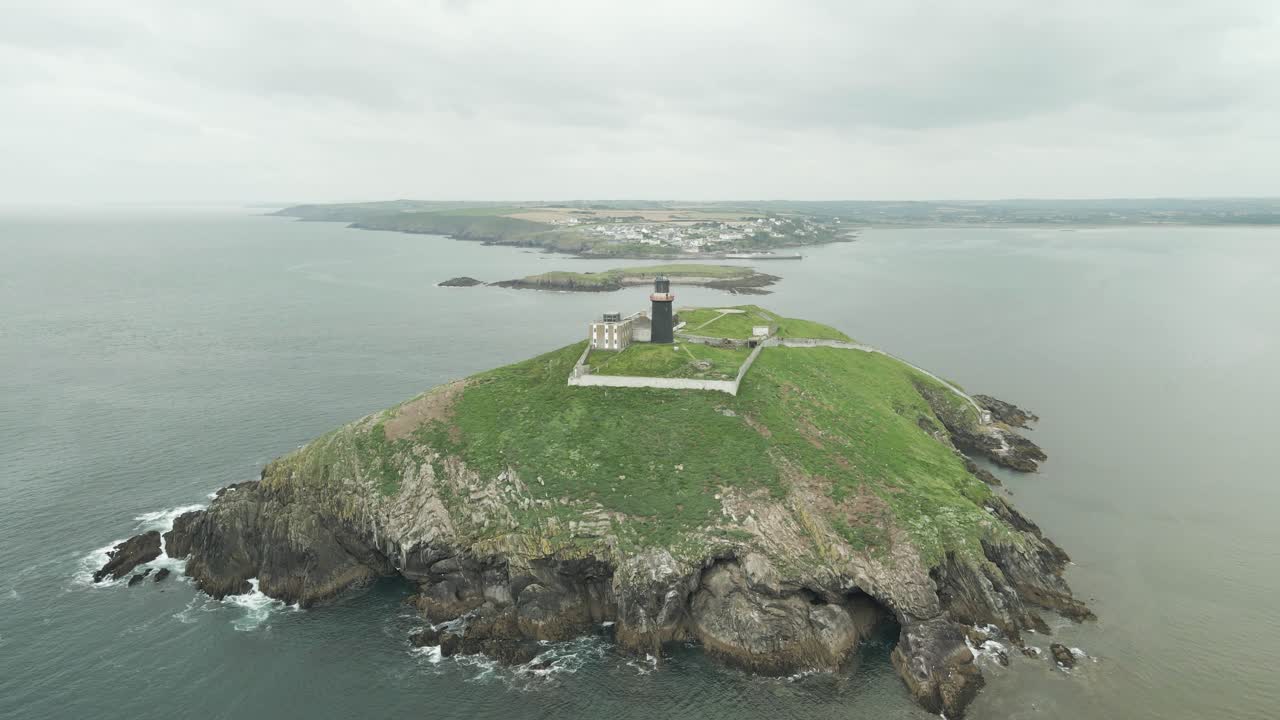 Aerial View Of Ballycotton Lighthouse At The Island Of County Cork In Ireland With Dramatic Sky In Background