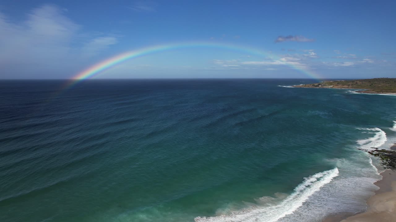 Scenic Rainbow Over Bay Of Fires In Tasmania, Australia - Aerial Drone Shot