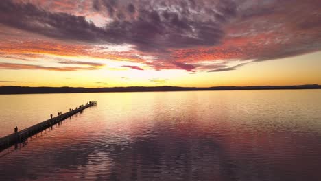 amazing aerial fire sunset at the long jetty pier at sydney central coast