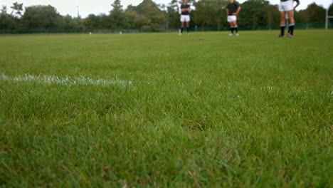 rugby players practising together