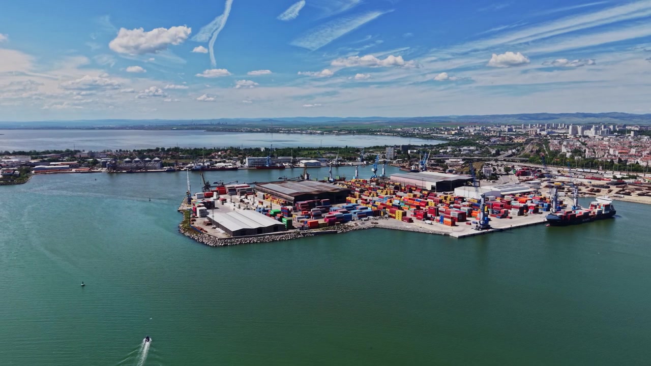 Oversized containers at busy shipping port during bright day