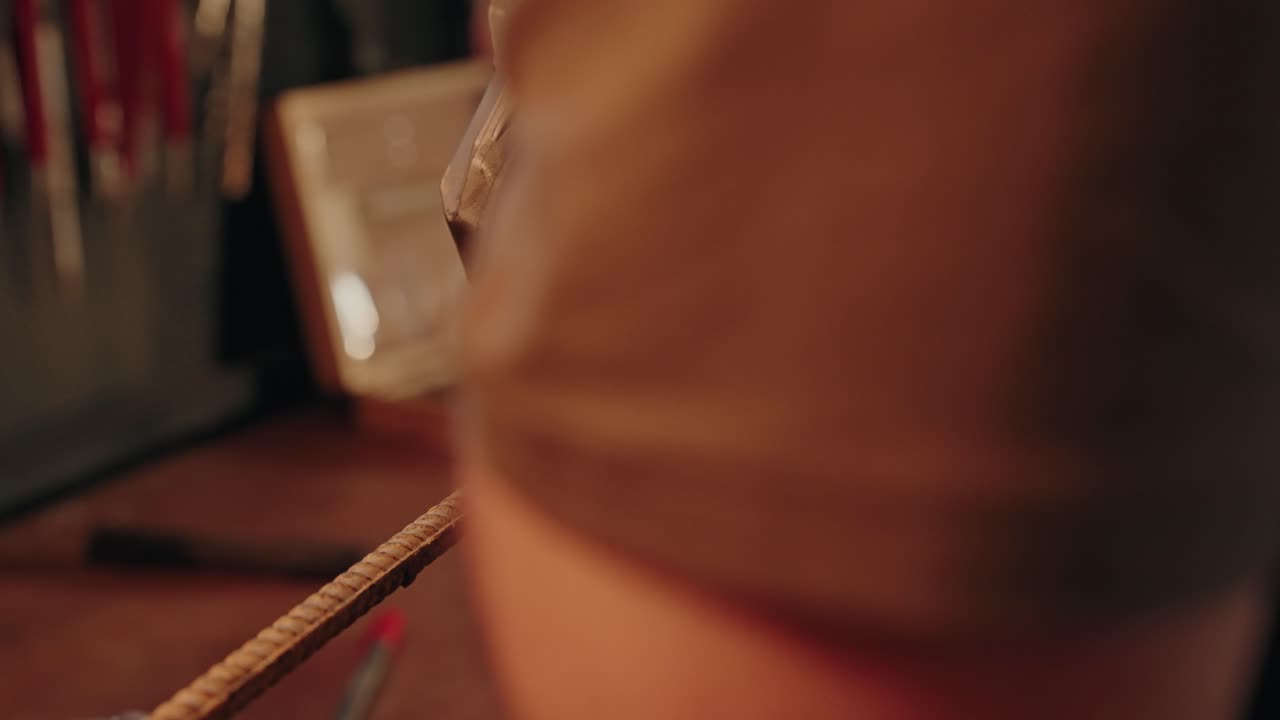 cutting metal with angle grinder in workshop with bright flying sparks