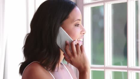 Pretty-happy-young-woman-having-a-phone-call