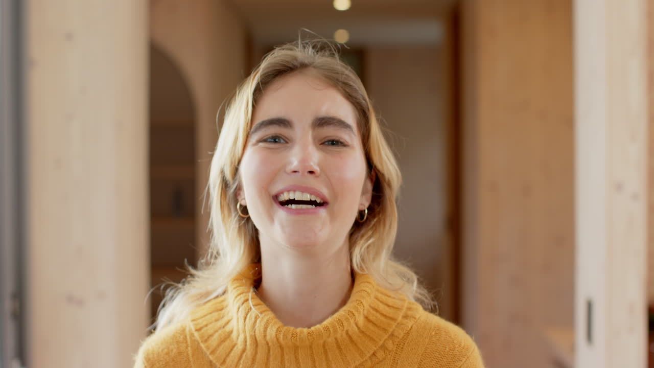 Christmas time, Smiling woman in cozy sweater enjoying festive atmosphere at home