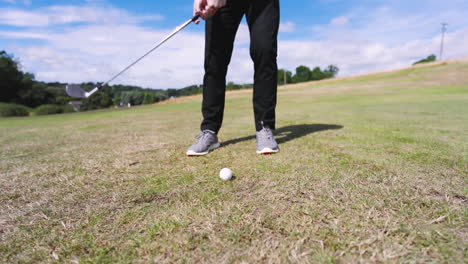 male golf player playing golf and knocking golf ball out on golf course, copy space