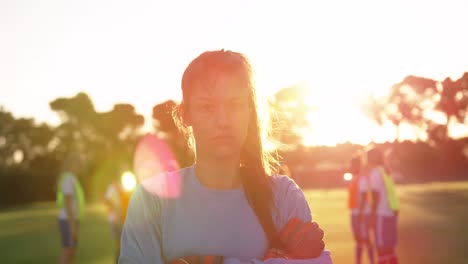 Female-soccer-player-standing-with-arms-crossed-on-soccer-field.-4k