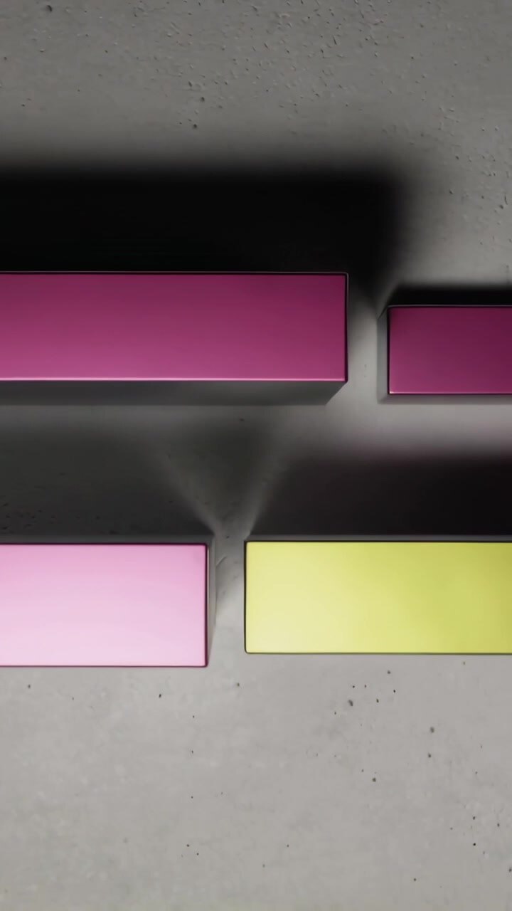 Vertical video: Sliding magenta cyan yellow bars on play over gray floor, aligning with shadows