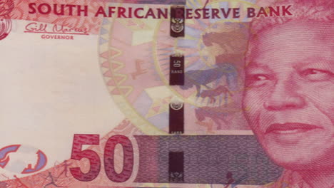 south african 50 rand banknotes with nelson mandela's portrait