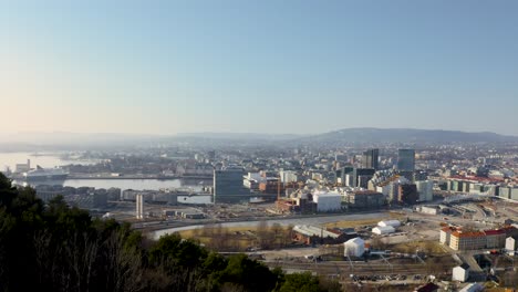 Overview-of-Oslo-city-centre-and-pan-over-the-Oslofjord-harbour-with-blue-sky