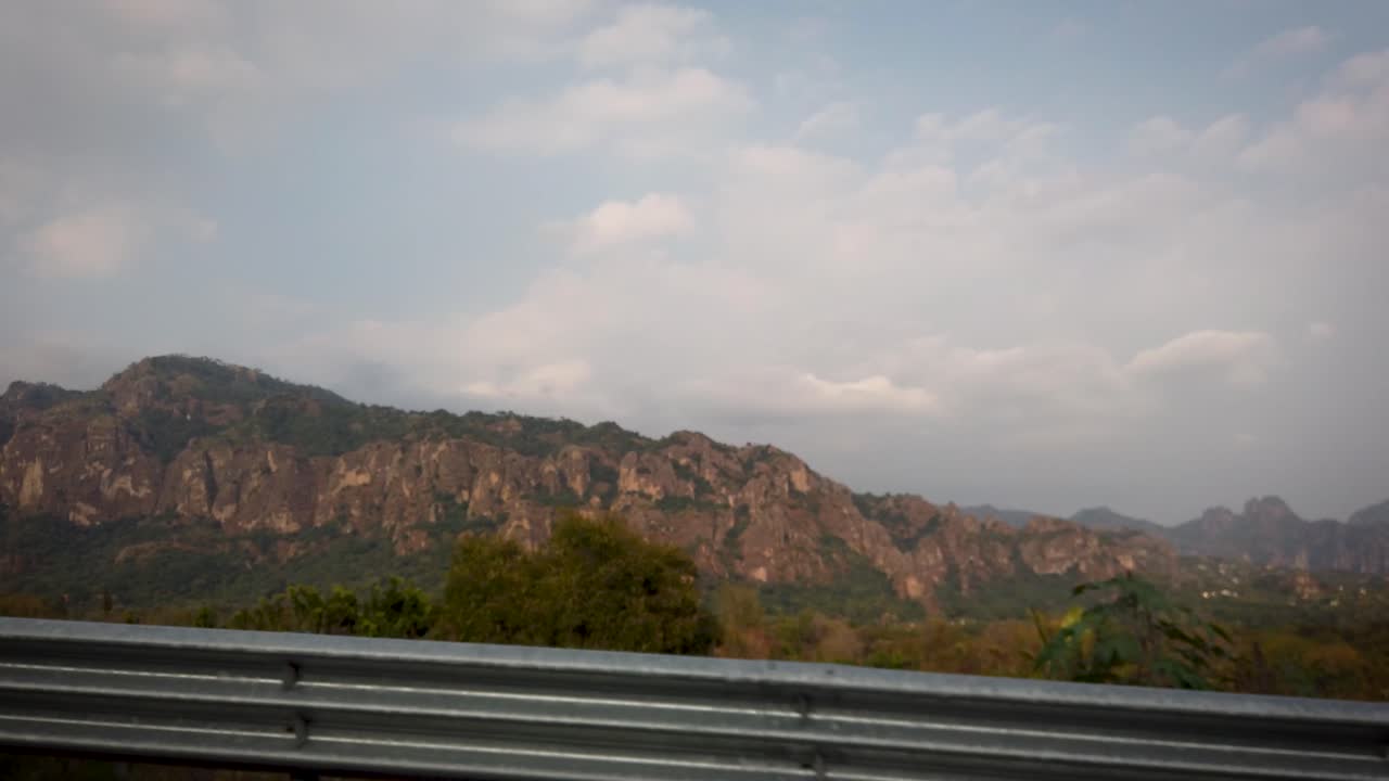 Static and detailed shot on the highway near Tepoztlán, Morelos, revealing the Sierra de Tepoztlán in central Mexico