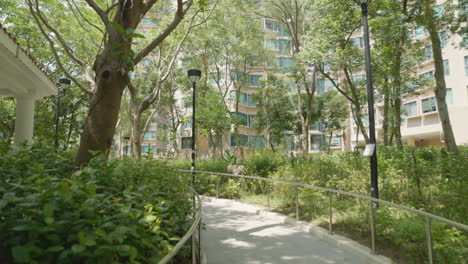 quick moving push in follows railing lined with street lamps in hong kong park