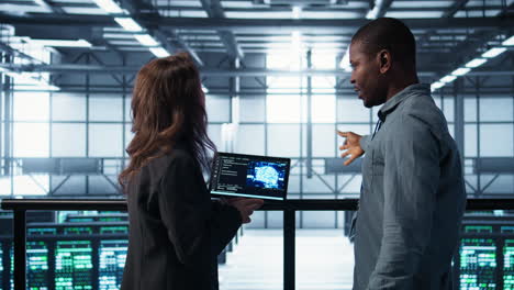 software developers in data center use ai technology on tablet
