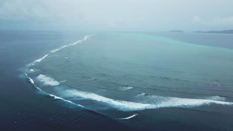 Drone-Nadi-Fiji-Wilks-Pass-Cloud-break-Swimming-Pools-surf-waves-WSL-surfers-aerial-cinematic-over-ocean-cloudy-morning-beautiful-peaceful-relaxing-honeymoon-adventure-resort-circling-movement