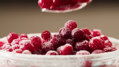 frozen cranberries cooking for tea or jam, background close up of cranberry berries in on the kitchen, chef making dessert healthy pie.