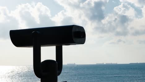 coastal viewpoint with binoculars