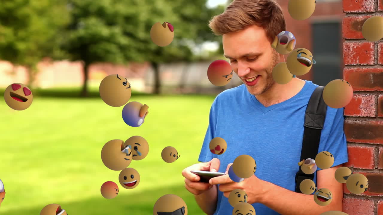 Icone emoji con un uomo che usa lo smartphone sullo sfondo