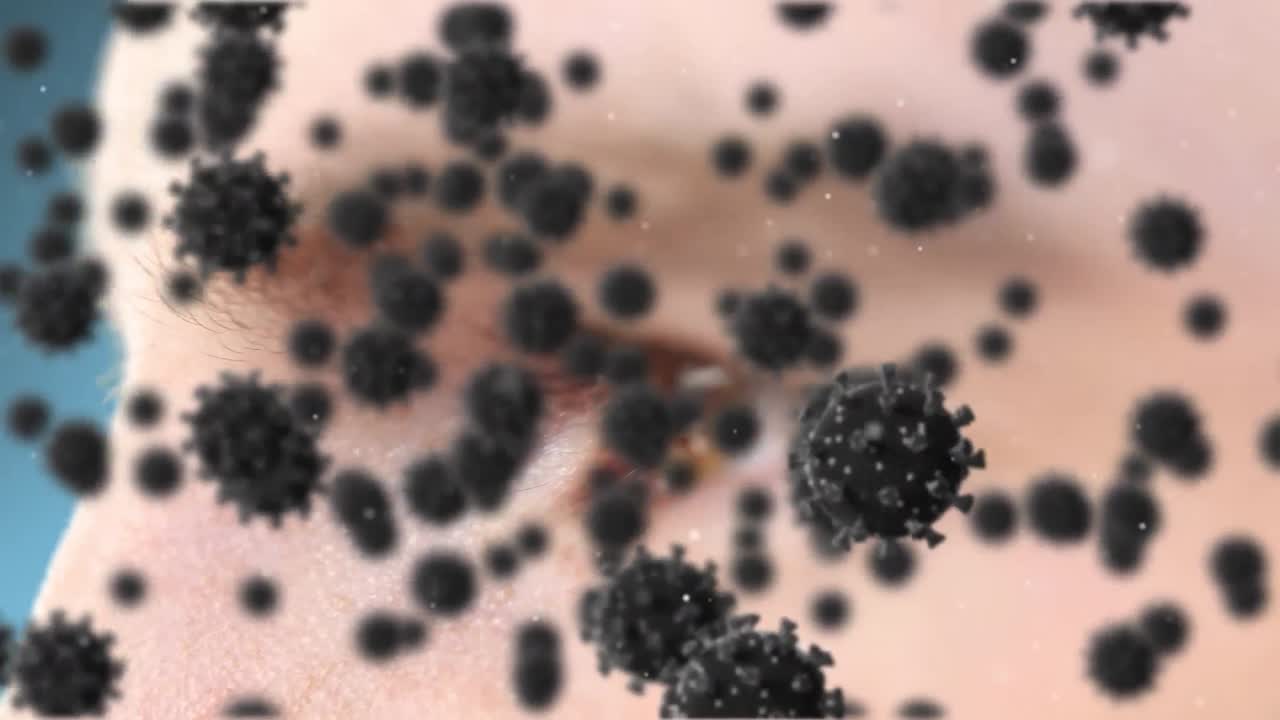 Animación de células de COVID-19 volando sobre una cabeza humana