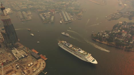 Sydney---Barangaroo---Cruise-Ship-leaving-Sydney-through-the-smoke-of-the-Bush-Fires